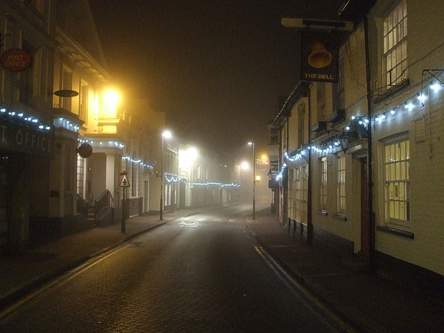 empty street with lights at night